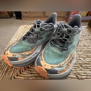 HOKA Stinson 7 running shoes in the Grey Skies/Pale Tangerine , size 9.5